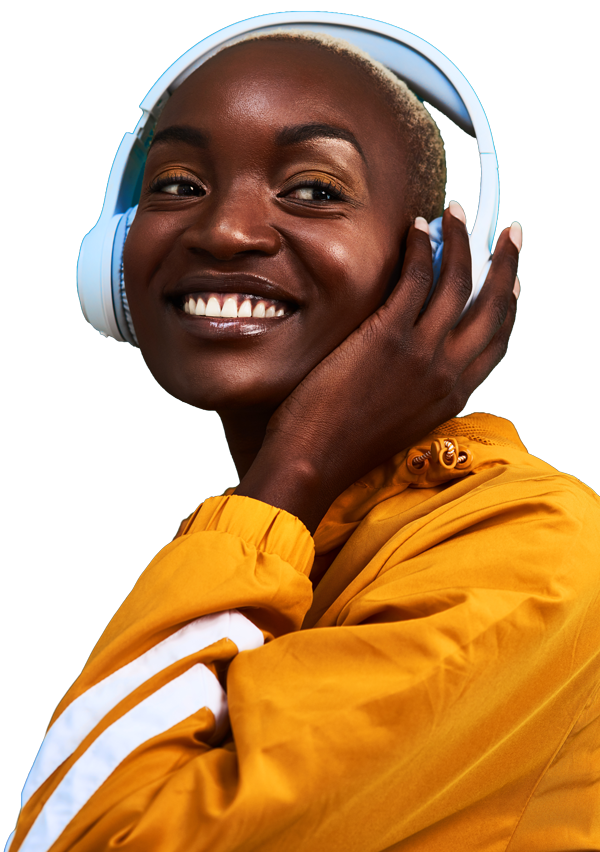 A creator smiling, wearing headphones.
