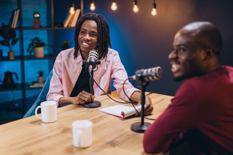 Two podcasters recording together