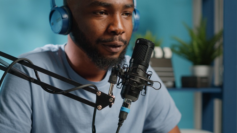 Vlogger speaking into a microphone