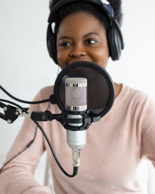 Woman recording a podcast